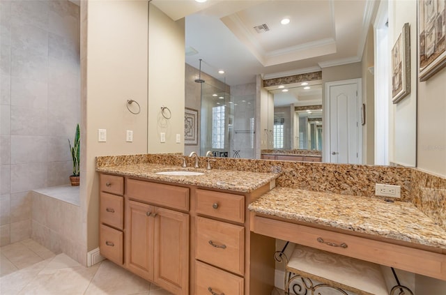 bathroom featuring tile patterned floors, a shower, crown molding, a raised ceiling, and vanity