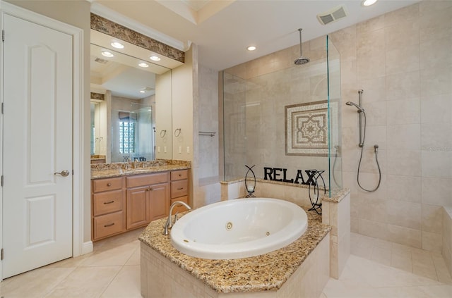 bathroom featuring vanity, shower with separate bathtub, and tile patterned flooring