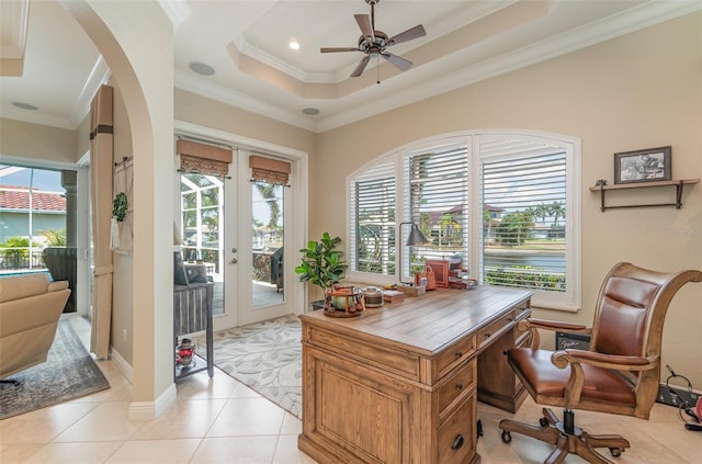 office featuring french doors, ornamental molding, ceiling fan, and light tile patterned floors