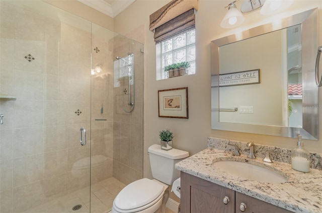 bathroom featuring vanity, crown molding, toilet, and an enclosed shower