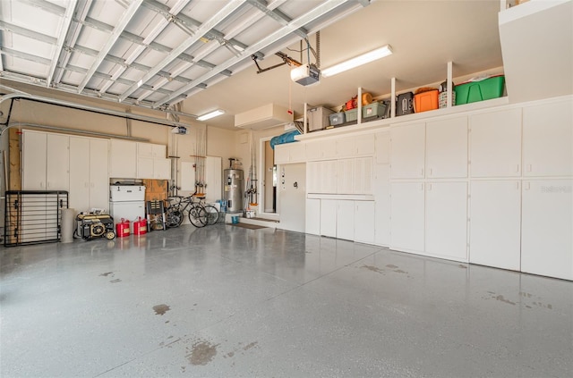 garage featuring a garage door opener, water heater, and white fridge