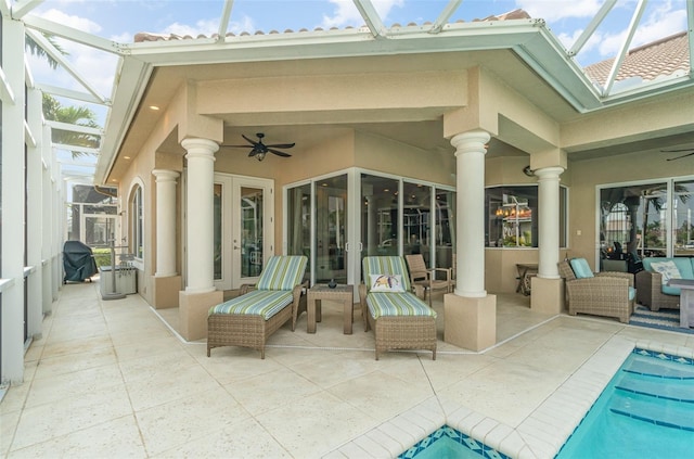 view of patio / terrace with glass enclosure and ceiling fan