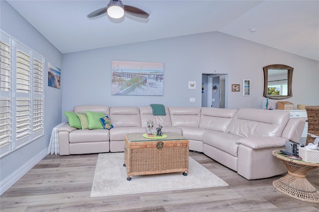 living room with lofted ceiling, light hardwood / wood-style floors, and ceiling fan