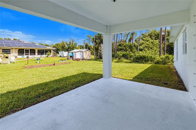 view of patio featuring a shed