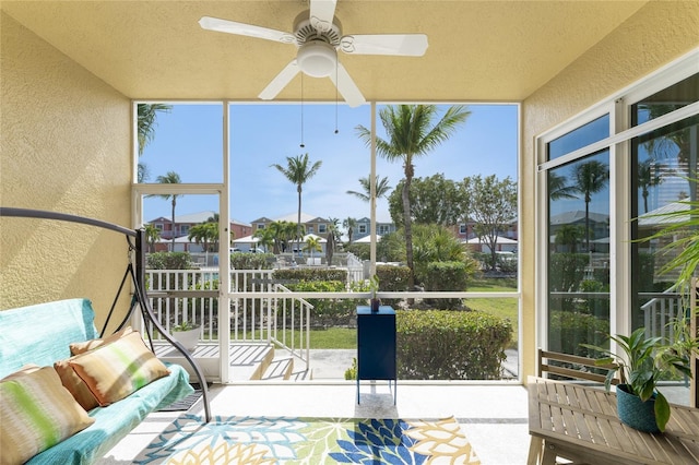 sunroom / solarium with ceiling fan and plenty of natural light