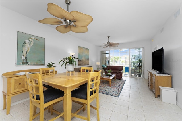 tiled dining room featuring ceiling fan