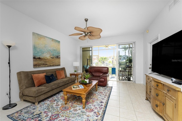 living room with light tile patterned flooring and ceiling fan