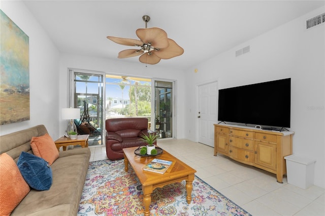 tiled living room featuring ceiling fan