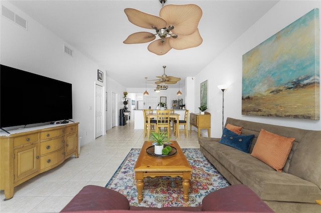 tiled living room featuring ceiling fan