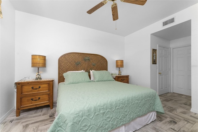 bedroom featuring ceiling fan and light parquet floors