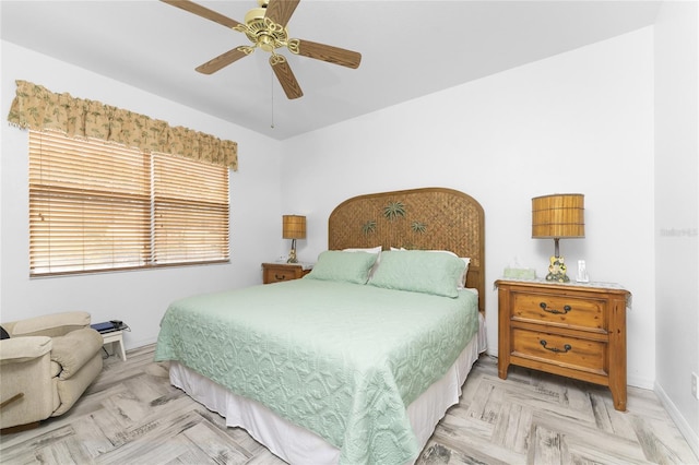 bedroom featuring ceiling fan and light parquet flooring