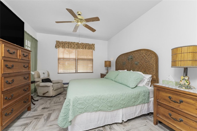 bedroom featuring light parquet flooring and ceiling fan