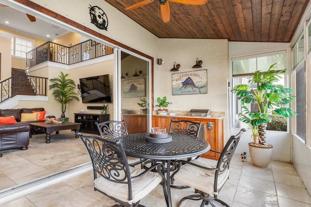 dining space featuring wooden ceiling, vaulted ceiling, and ceiling fan