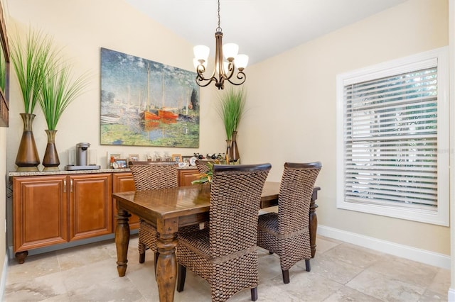 dining space with a chandelier