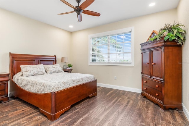 bedroom with dark hardwood / wood-style flooring and ceiling fan