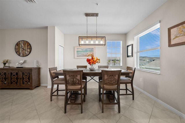 dining area with light tile patterned floors