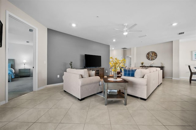 living room featuring ceiling fan and light tile patterned flooring