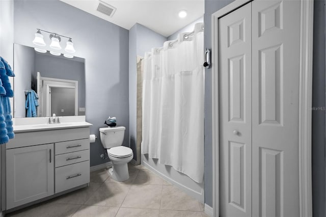 full bathroom featuring tile patterned flooring, vanity, toilet, and shower / bath combo with shower curtain