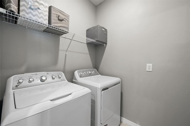 laundry area with independent washer and dryer