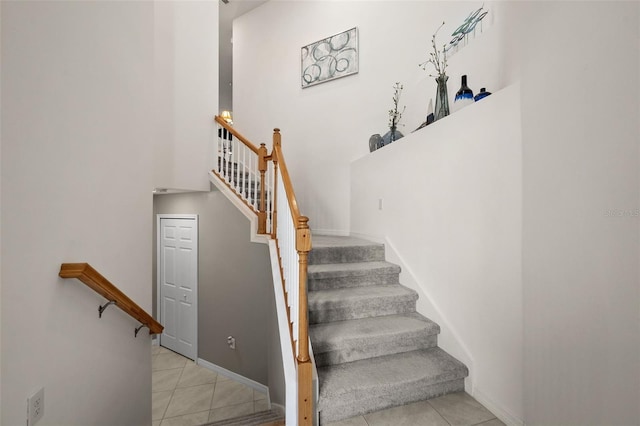 stairs featuring tile patterned flooring