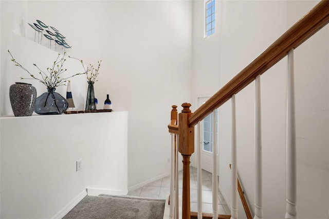 stairs featuring tile patterned flooring