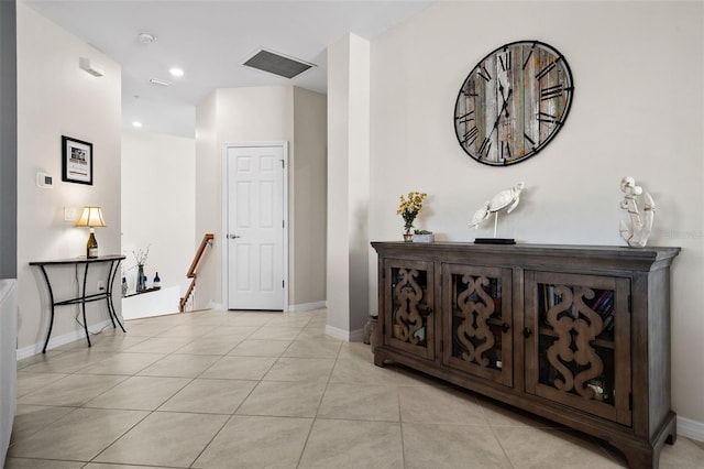 corridor with light tile patterned floors