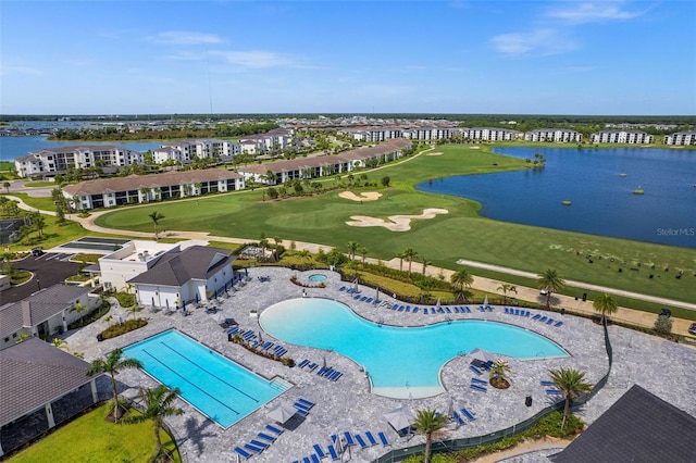 birds eye view of property with a water view