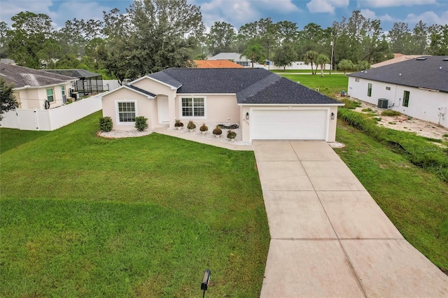 single story home with central air condition unit, a front lawn, and a garage