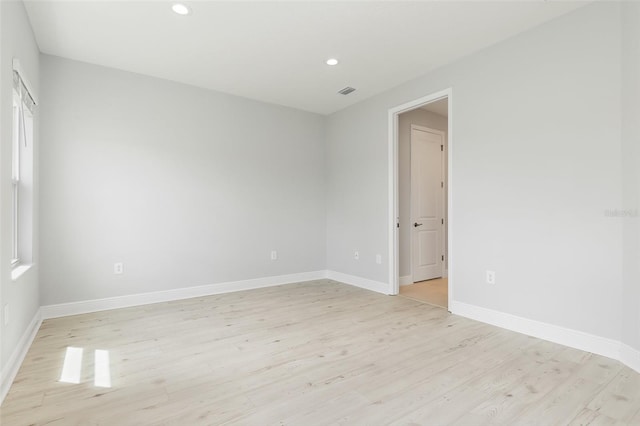 unfurnished room with light hardwood / wood-style floors