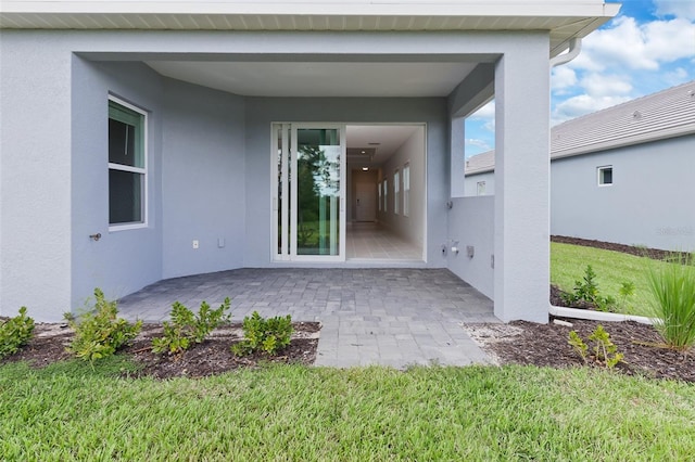 exterior space featuring a yard and a patio area