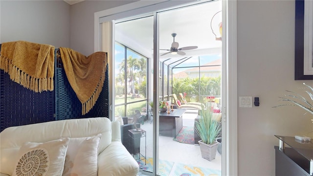 doorway to outside featuring ceiling fan