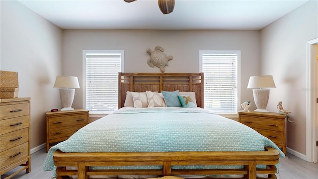 bedroom with ceiling fan and light hardwood / wood-style flooring