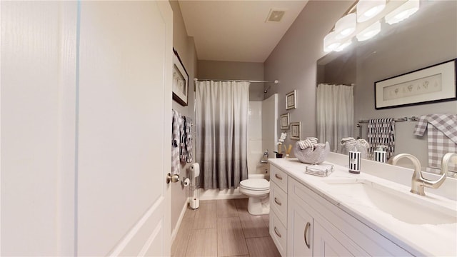 full bathroom featuring vanity, toilet, and shower / bath combo with shower curtain