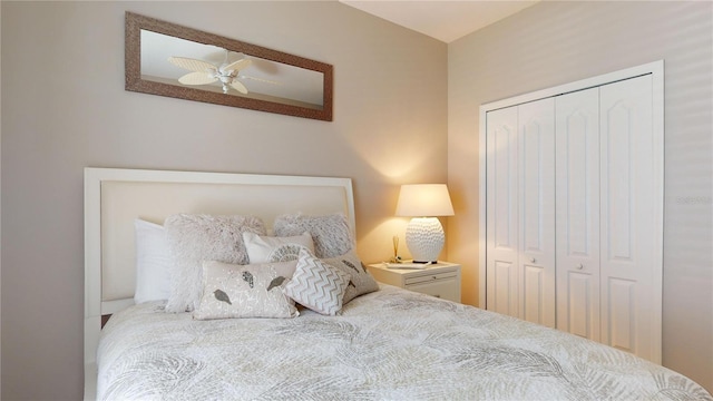 bedroom with ceiling fan and a closet