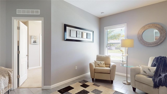 living area featuring light tile patterned floors