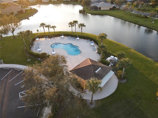 aerial view at dusk with a water view