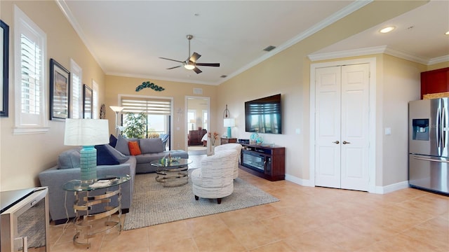 tiled living room with ceiling fan and ornamental molding