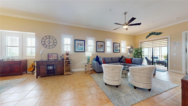 tiled living room with ceiling fan and crown molding