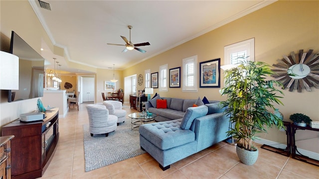 living room featuring ceiling fan with notable chandelier, ornamental molding, and light tile patterned floors