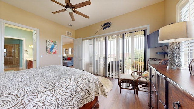 bedroom featuring multiple windows, access to outside, ceiling fan, and hardwood / wood-style flooring