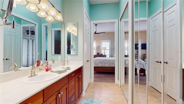 bathroom featuring ceiling fan, vanity, and tile patterned floors