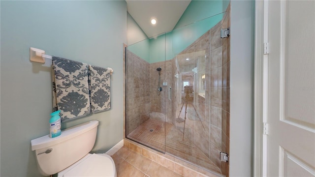 bathroom with walk in shower, toilet, and tile patterned floors