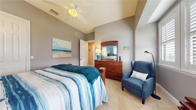 carpeted bedroom featuring vaulted ceiling and ceiling fan