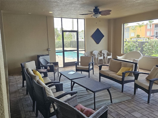 interior space featuring ceiling fan and an outdoor living space