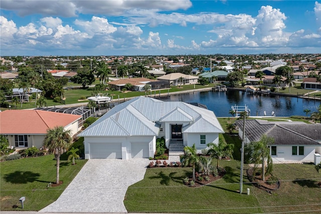 birds eye view of property with a water view