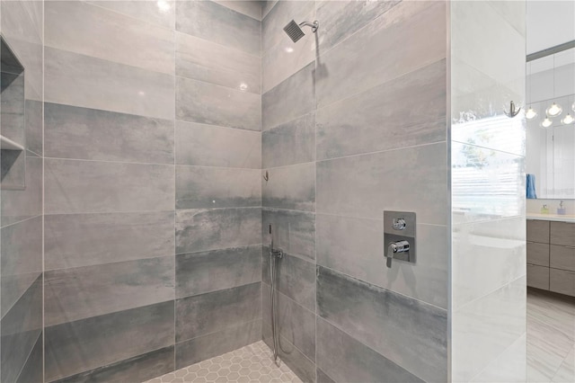 bathroom featuring vanity and a tile shower