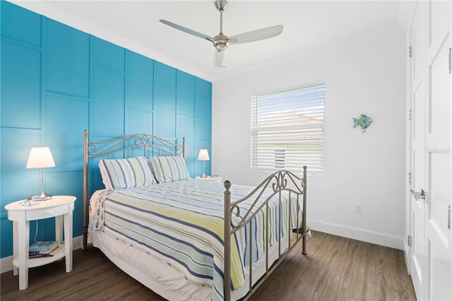 bedroom featuring dark wood-type flooring and ceiling fan