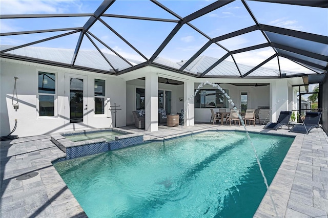 view of swimming pool featuring a lanai, a patio, ceiling fan, and an in ground hot tub