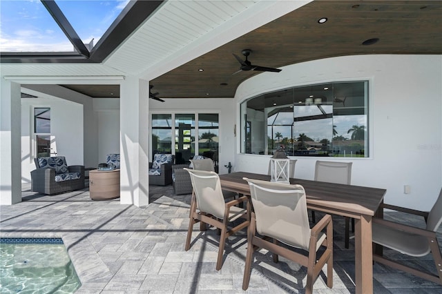 view of patio / terrace with a swimming pool and ceiling fan