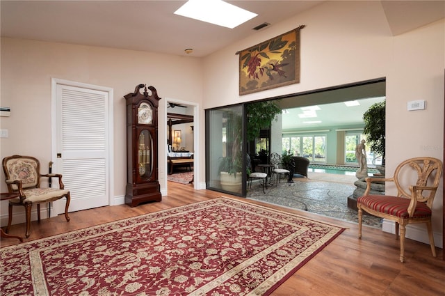 sitting room with hardwood / wood-style floors